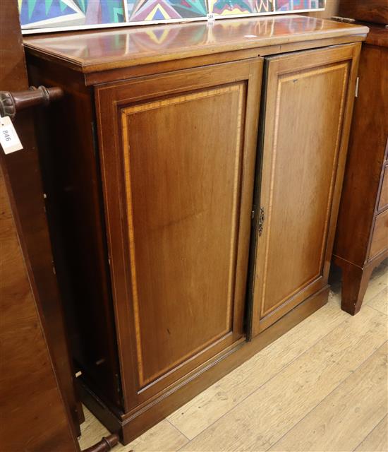 An Edwardian satinwood banded two-door mahogany side cabinet W.108cm